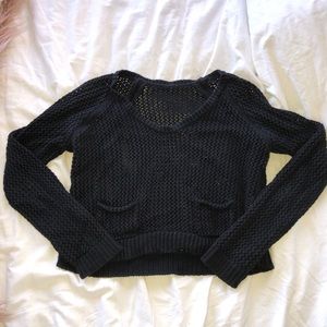 Black cropped sweater with front pockets